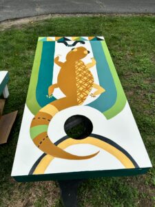 hand-painted lizard cornhole board