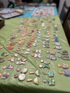 polymer clay earrings laid out on table ready for metal hardware